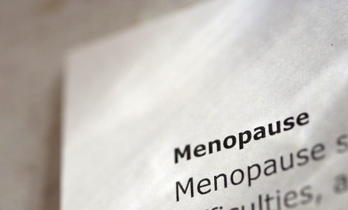 Close-up of the word menopause in a medical text, representing menopause education and awareness.